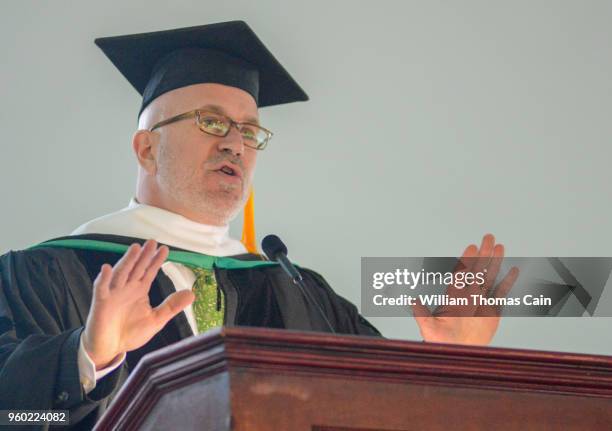 And SiriusXM talk show host Michael Smerconish addresses graduates after receiving an Honorary Doctor of Letters during commencement exercises at...