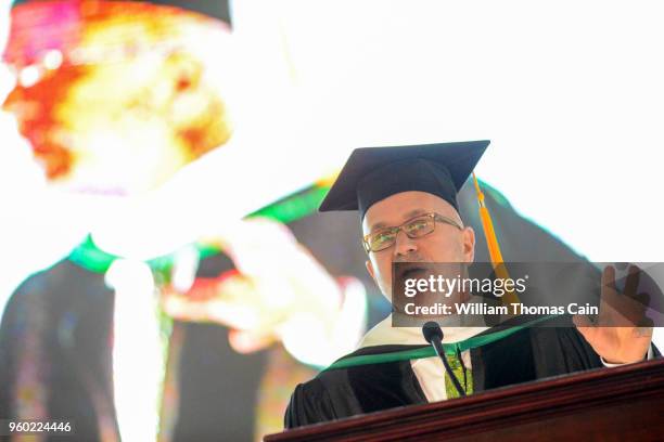 And SiriusXM talk show host Michael Smerconish addresses graduates after receiving an Honorary Doctor of Letters during commencement exercises at...