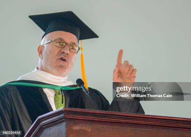 And SiriusXM talk show host Michael Smerconish addresses graduates after receiving an Honorary Doctor of Letters during commencement exercises at...