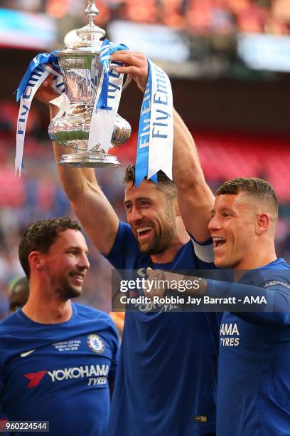 Danny Drinkwater, Gary Cahill and Ross Barkley of Chelsea pose with the trophy at the end of the Emirates FA Cup Final between Chelsea and Manchester...