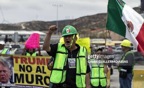 Membres of a pro-migration association hold a protest against US President Donald Trump policies and anti immigrant rhetoric at San Ysidro Port of...