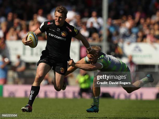 Lachie Turner of Exeter breaks past Chris Harris during the Aviva Premiership Semi Final between Exeter Chiefs and Newcastle Falcons at Sandy Park on...