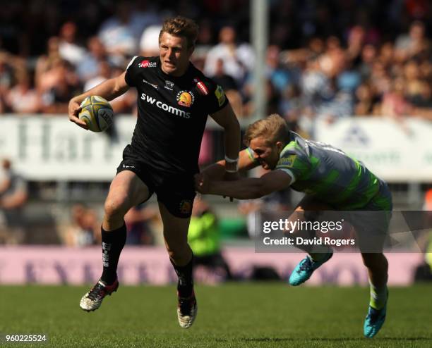 Lachie Turner of Exeter breaks past Chris Harris during the Aviva Premiership Semi Final between Exeter Chiefs and Newcastle Falcons at Sandy Park on...