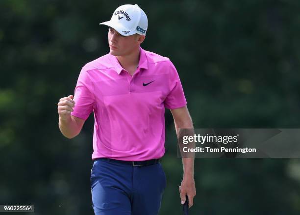 Aaron Wise reacts following a birdie putt on the 17th green during the third round of the AT&T Byron Nelson at Trinity Forest Golf Club on May 19,...