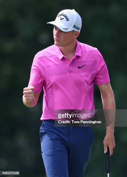 Aaron Wise reacts following a birdie putt on the 17th green during the third round of the AT&T Byron Nelson at Trinity Forest Golf Club on May 19,...
