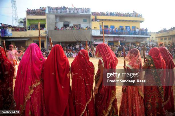 holi- festival of colours - lathmaar holi stock pictures, royalty-free photos & images