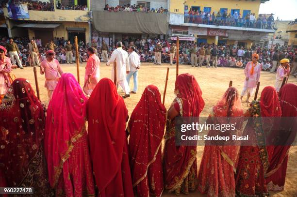 holi- festival of colours - lathmaar holi stock pictures, royalty-free photos & images