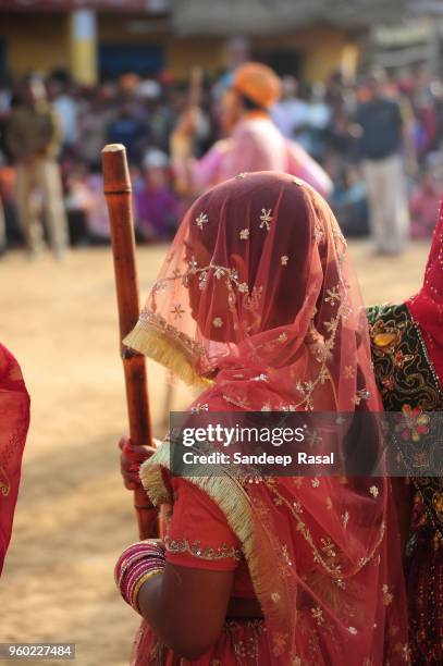 holi- festival of colours - lathmaar holi stock pictures, royalty-free photos & images