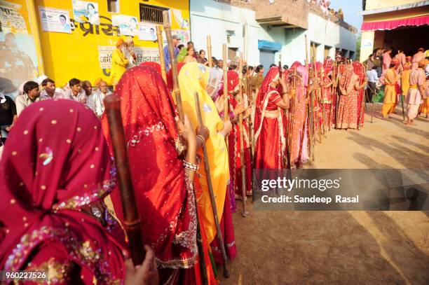 holi- festival of colours - lathmaar holi stock pictures, royalty-free photos & images