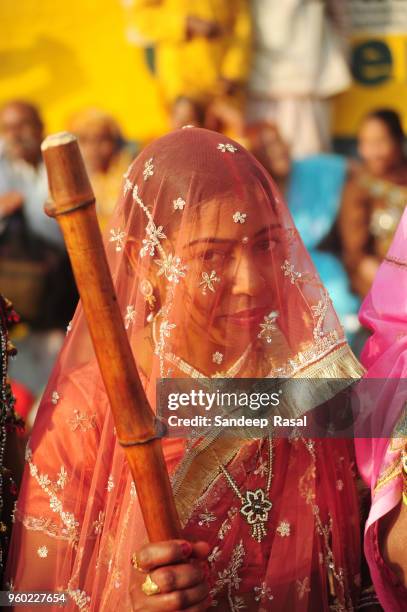 holi- festival of colours - lathmaar holi stock pictures, royalty-free photos & images