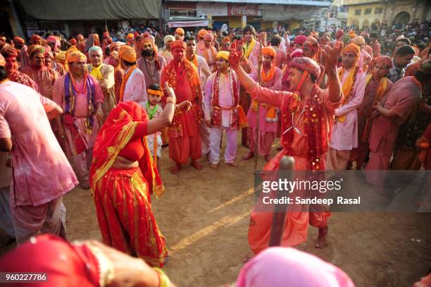 holi- festival of colours - lathmaar holi stock pictures, royalty-free photos & images