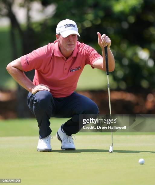 Steve Stricker of the United States lines up a putt on the 15th green during the third round of the Regions Tradition at Greystone Golf & Country...