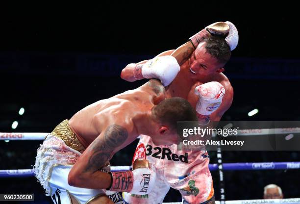 Lee Selby and Josh Warrington trade punches during IBF Featherweight Championship fight at Elland Road on May 19, 2018 in Leeds, England.