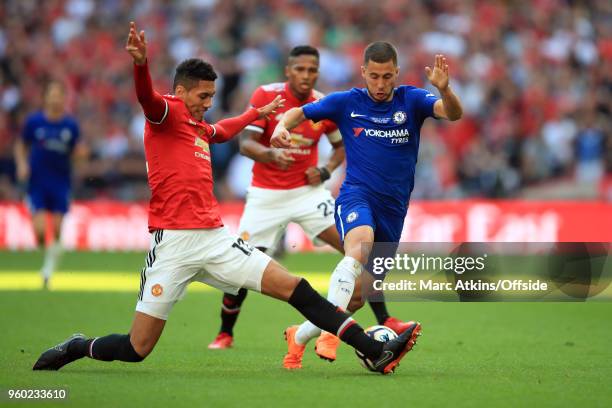 Eden Hazard of Chelsea in action with Chris Smalling of Manchester United during The Emirates FA Cup Final between Chelsea and Manchester United at...