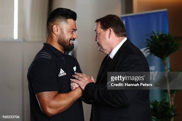 Head coach Steve Hansen of the All Blacks congratulates Jordan Taufua after being named in the New Zealand All Blacks squad following the team...