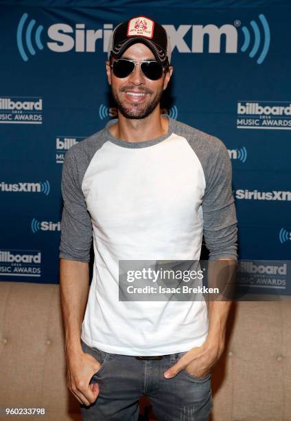 Enrique Iglesias attends The Morning Mash Up on SiriusXM Hits 1 backstage broadcast leading up to the Billboard Music Awards on May 19, 2018 in Las...