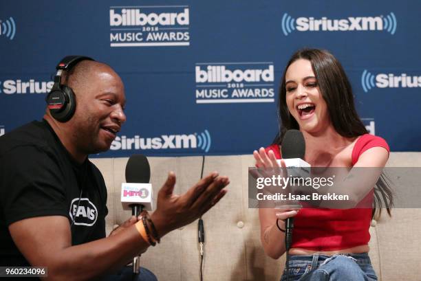 Stanley T talks with Bea Miller during The Morning Mash Up on SiriusXM Hits 1 backstage broadcast leading up to the Billboard Music Awards on May 19,...