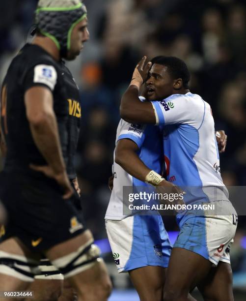 South Africa's Bulls full back Warick Gelant celebrates with teammate after scoring against Argentina's Jaguares during their Super Rugby match at...