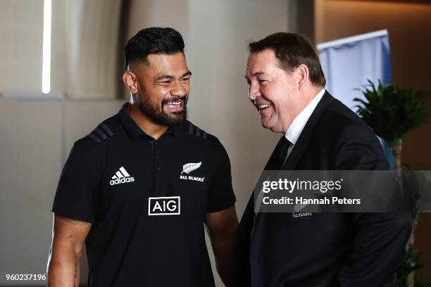 Head coach Steve Hansen of the All Blacks congratulates Jordan Taufua after being named in the New Zealand All Blacks squad following the team...