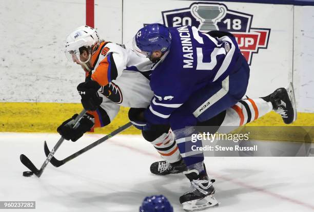 Cole Bardreau falls as Toronto Marlies defenseman Martin Marincin watches him as the Toronto Marlies beat the Lehigh Valley Phantoms 4-3 in the first...