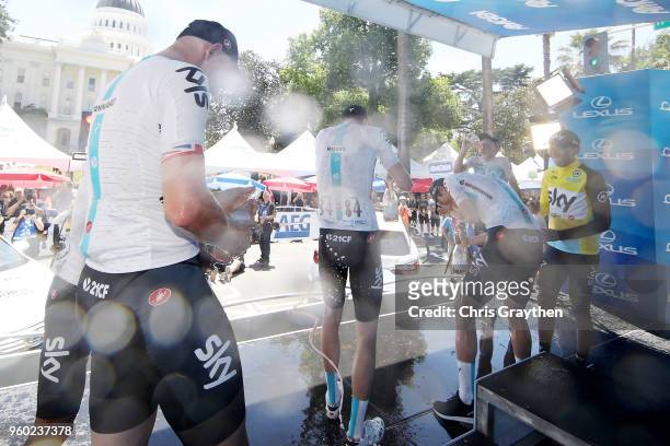 Ian Stannard of Great Britain riding for Team Sky and Luke Rowe of Great Britain riding for Team Sky celebrate with champagne on the podium after...