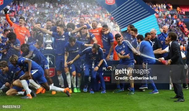 Antonio Conte manager / head coach of Chelsea sprays champagne as the team celebrate after The Emirates FA Cup Final between Chelsea and Manchester...
