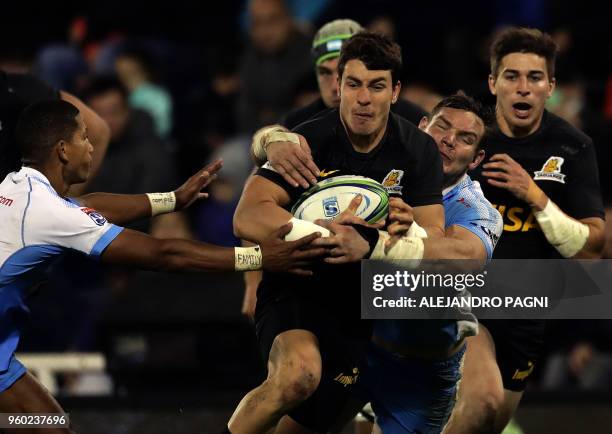 Argentina's Jaguares half scrum Gonzalo Bertranou runs with the ball during their Super Rugby match against South Africa's Bulls at Jose Amalfitani...