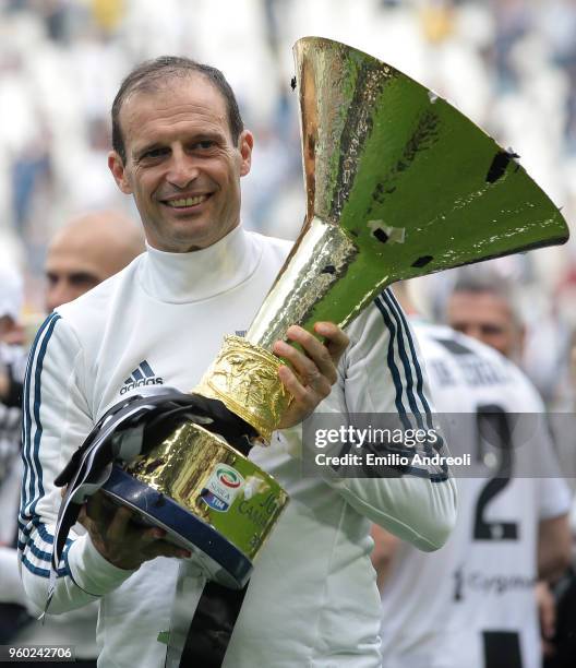 Juventus FC coach Massimiliano Allegri celebrates with the trophy after winning the Serie A Championship at the end of the serie A match between...