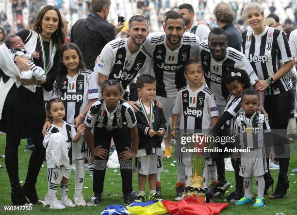 Miralem Pjanic, Medhi Benatia and Blaise Matuidi of Juventus FC celebrate with the trophy after winning the Serie A Championship at the end of the...