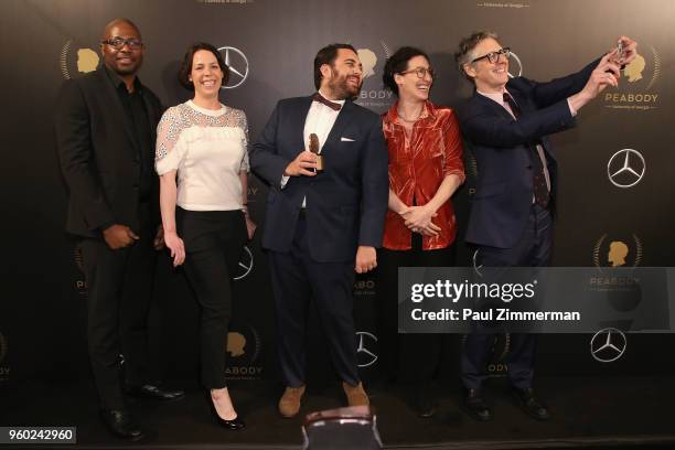 Neil Drumming, Julie Snyder, Producer Brian Reed, Sarah Koenig, and Ira Glass of S-Town pose with a Peabody award at The 77th Annual Peabody Awards...