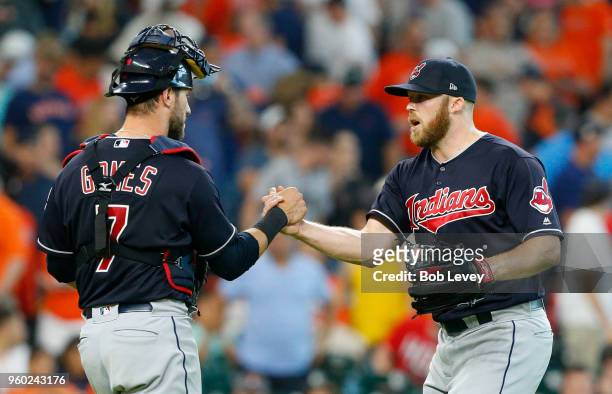 Cody Allen of the Cleveland Indians shakes hands with Yan Gomes after the final out against the Houston Astros at Minute Maid Park on May 19, 2018 in...
