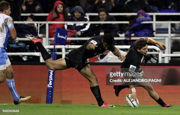 Argentina's Jaguares wing Sebastian Cancelliere scores a try against South Africa's Bulls during their Super Rugby match at Jose Amalfitani stadium...