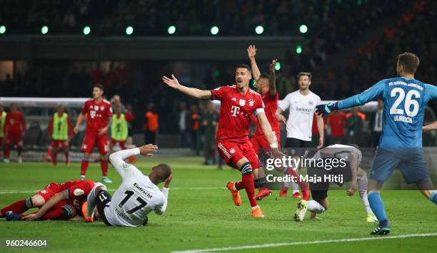 Sandro Wagner of FC Bayern Muenchen reacts as Javi Martinez of FC Bayern Muenchen and by Kevin-Prince Boateng of Eintracht Frankfurt lay on the pitch...