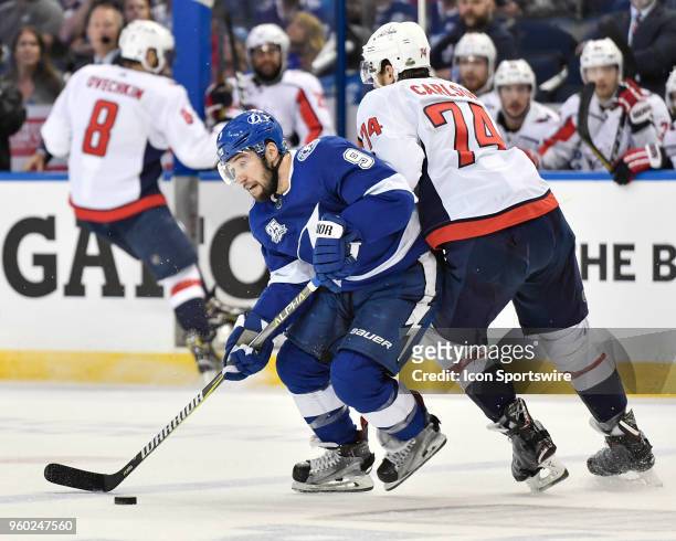 Tampa Bay Lightning center Tyler Johnson turns away from Washington Capitals defender John Carlson during the first period of the fifth game of the...