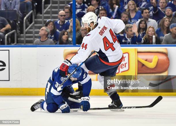 Washington Capitals defender Brooks Orpik and Tampa Bay Lightning center Yanni Gourde get tangled up during the first period of the fifth game of the...