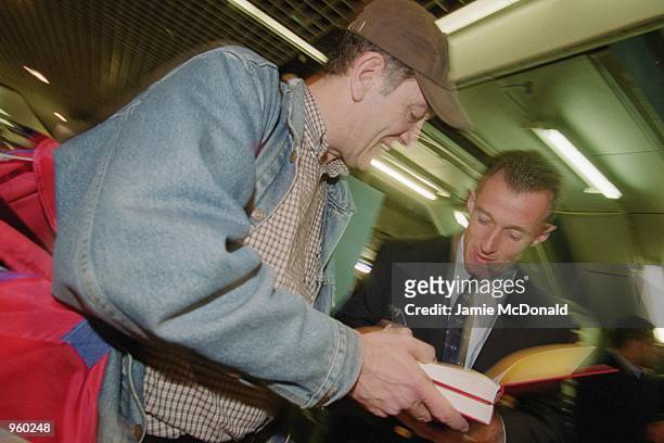 Rob Howley signs an autograph at Heathrow Airport prior to his departure on the British Lions tour of Australia. \ Mandatory Credit: Jamie McDonald...