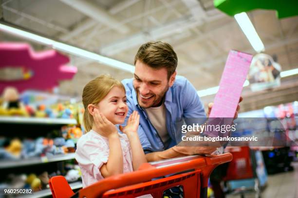 family shopping - toy store stock pictures, royalty-free photos & images