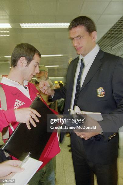 Tour Captain Martin Johnson signs an autograph at Heathrow Airport prior to his departure on the British Lions tour of Australia. \ Mandatory Credit:...