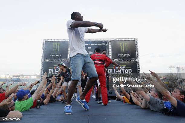 Devin Funchess of the Carolina Panthers, a guest of Austin Dillon, driver of the Dow Chevrolet, participate in pre-race ceremonies prior to the start...