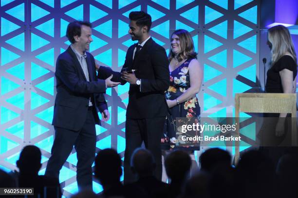 Mike Birbiglia presents the Entertainment Award on to Hasan Minhaj of "Hasan Minhaj: Homecoming King" on stage during The 77th Annual Peabody Awards...