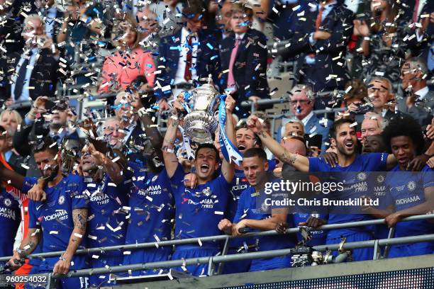 Cesar Azpilicueta of Chelsea lifts the FA Cup trophy after his side won during the Emirates FA Cup Final between Chelsea and Manchester United at...