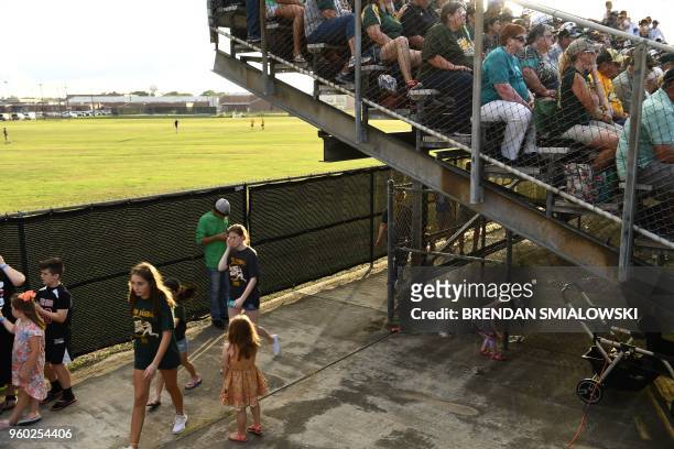 Fans of the Santa Fe HS baseball team attend a game in Deer Park, Texas on May 19, 2018. The game was to be played last night but rescheduled for...
