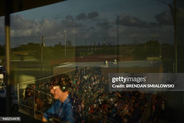 Fans of the Santa Fe HS baseball team attend a game in Deer Park, Texas on May 19, 2018. The game was to be played last night but rescheduled for...