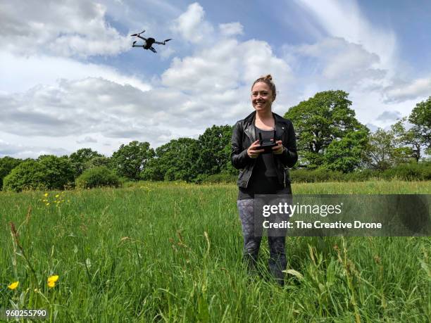 female drone pilot - unmanned aerial vehicle stock pictures, royalty-free photos & images