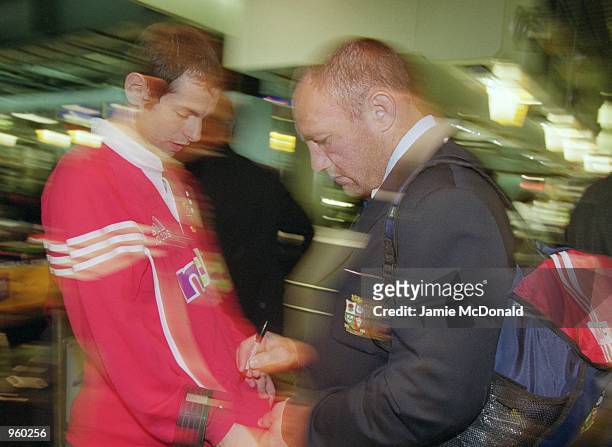 Robin McBryde signs an autograph at Heathrow Airport prior to his departure on the British Lions tour of Australia. \ Mandatory Credit: Jamie...