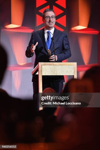 Comedian John Oliver of Last Week Tonight with John Oliver accepts Peabody award onstage during The 77th Annual Peabody Awards Ceremony at Cipriani...