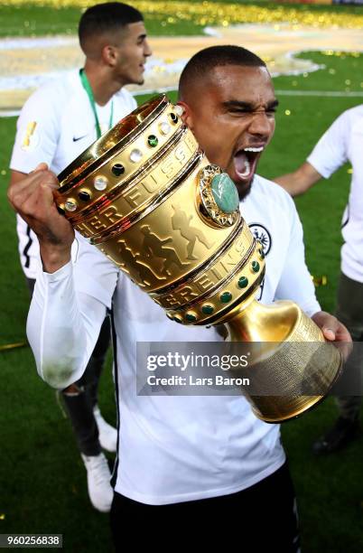 Prince Kevin Boateng celebrates with the trophy after winning the DFB Cup final between Bayern Muenchen and Eintracht Frankfurt at Olympiastadion on...