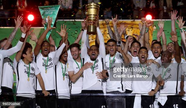 Prince Kevin Boateng celebrates with the trophy after winning the DFB Cup final between Bayern Muenchen and Eintracht Frankfurt at Olympiastadion on...