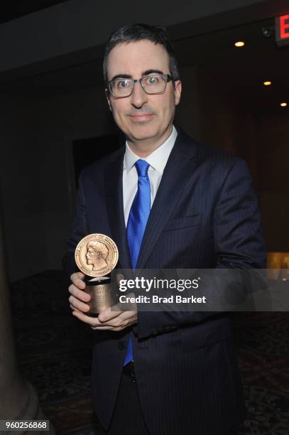 Comedian John Oliver of Last Week Tonight with John Oliver poses with Peabody award during The 77th Annual Peabody Awards Ceremony at Cipriani Wall...