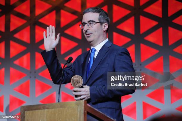 Comedian John Oliver of Last Week Tonight with John Oliver accepts Peabody award onstage during The 77th Annual Peabody Awards Ceremony at Cipriani...